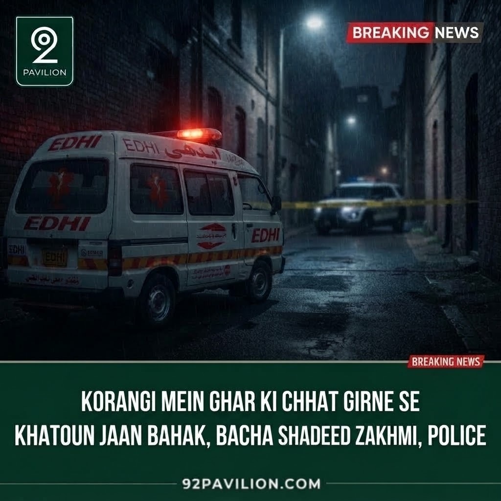 Edhi ambulance and police vehicle at a nighttime accident scene representing a fatal roof collapse in Korangi, Karachi