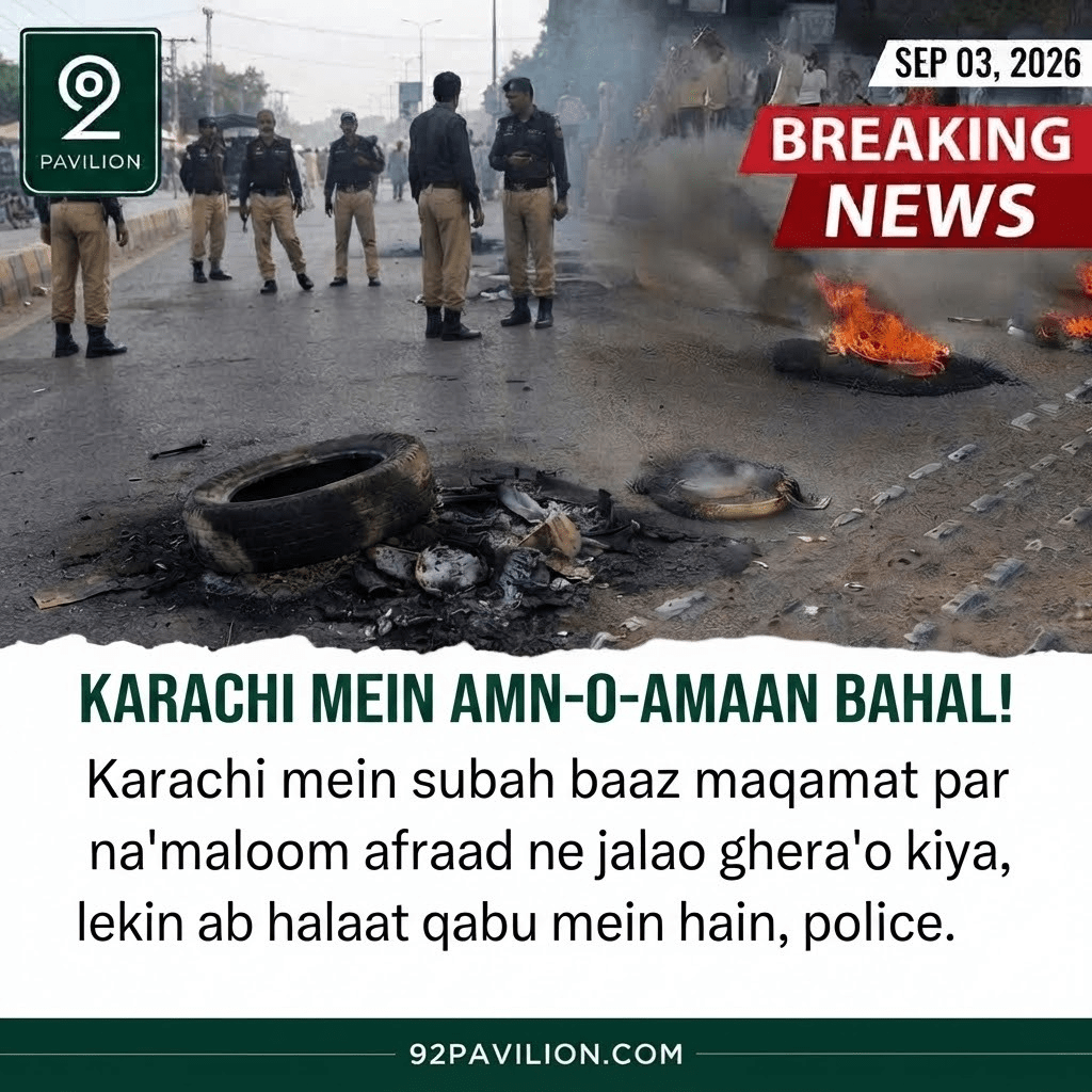 Karachi police officers stand near burnt tyres on a road after JI's September 3 strike as law and order is restored